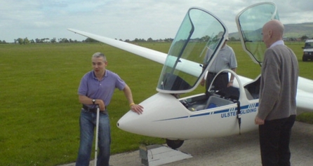 Person with disability beside a glider
